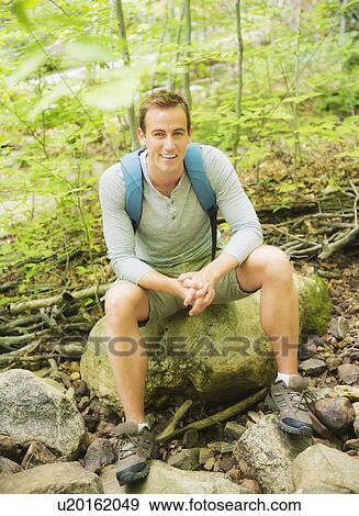Portrait of man resting in forest View Large Photo Image Stock Photo - Portrait of man resting in forest. Fotosearch