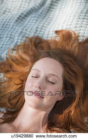 Stock Image - Portrait of woman sleeping. Fotosearch