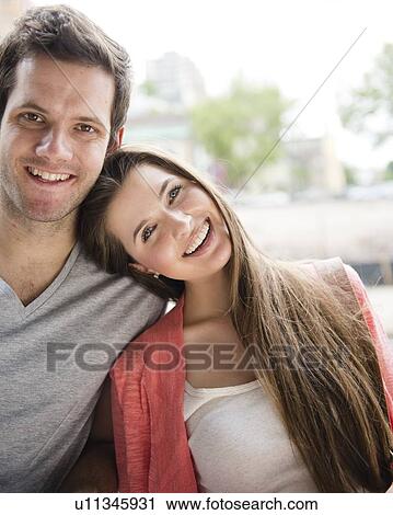 Stock Image - Portrait of young couple. Fotosearch