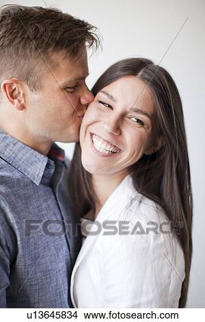 Picture - Portrait of young couple, studio shot. Fotosearch