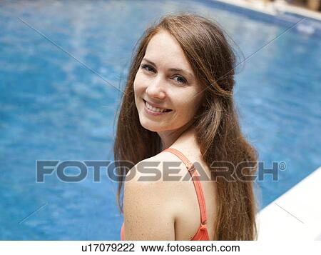 Portrait of young woman at swimming pool View Large Photo Image Stock Image - Portrait of young woman at swimming pool. Fotosearch