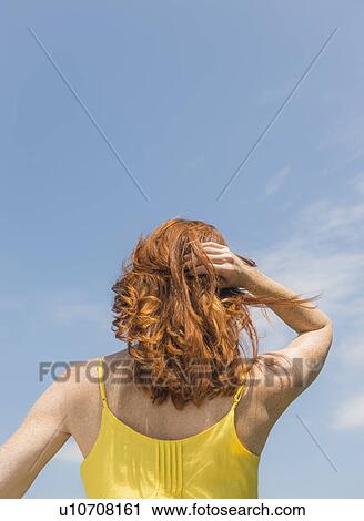 Stock Image - Rear view of woman. Fotosearch