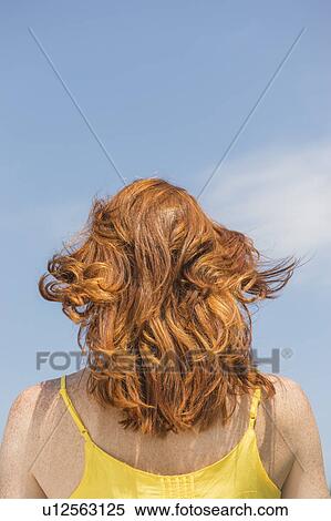 Stock Photography - Rear view of woman. Fotosearch