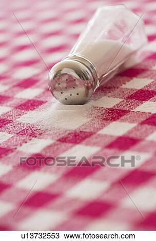 Salt shaker on checked tablecloth View Large Photo Image Stock Image - Salt shaker on checked tablecloth. Fotosearch