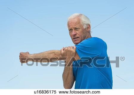 Senior man stretching outdoors View Large Photo Image Stock Photography - Senior man stretching outdoors. Fotosearch