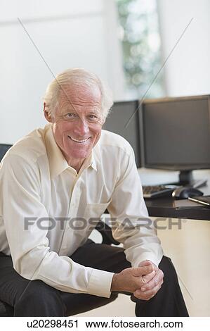 Stock Image - Senior professional in office. Fotosearch