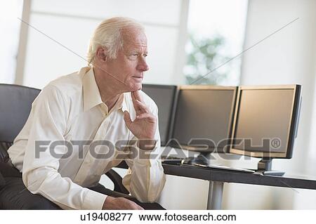 Stock Photo - Senior professional in office. Fotosearch