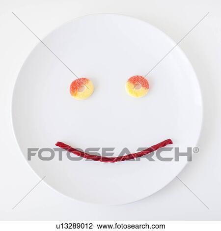 Smiley face on plate made out of jelly beans View Large Photo Image Stock Image - Smiley face on plate made out of jelly beans. Fotosearch