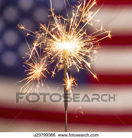 Sparkler and American flag View Large Photo Image Stock Photograph - Sparkler and American flag. Fotosearch