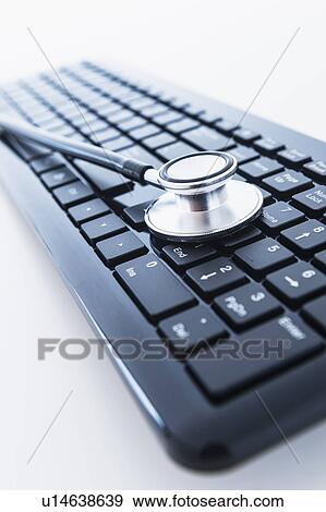 Stethoscope on computer keyboard View Large Photo Image Stock Photo - Stethoscope on computer keyboard. Fotosearch