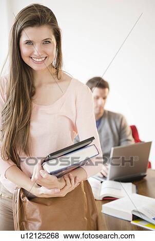 Stock Photo - Students in library. Fotosearch
