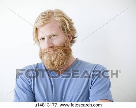 Stock Photo - Studio portrait of man with beard. Fotosearch
