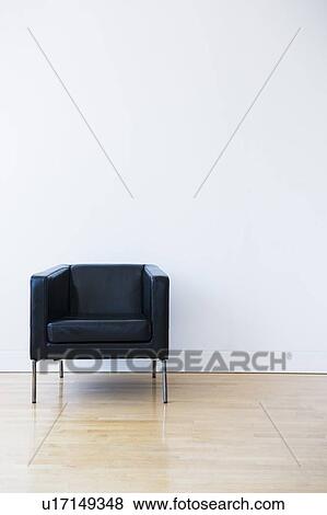 Studio shot of black leather chair View Large Photo Image Stock Photo - Studio shot of black leather chair. Fotosearch