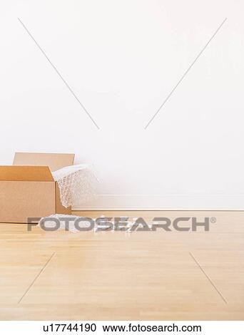 Stock Image - Studio shot of cardboard box. Fotosearch