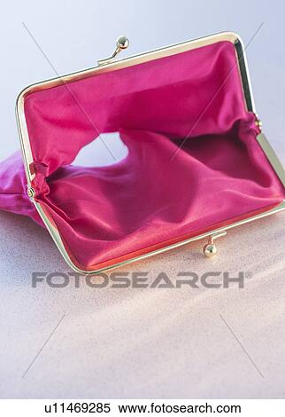 Stock Photography - Studio shot of empty pink purse. Fotosearch