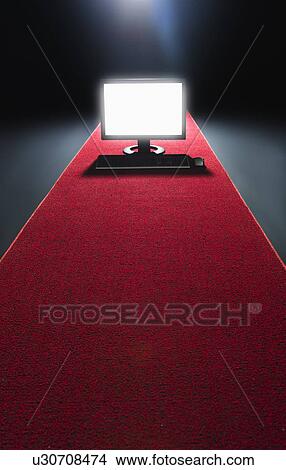 Studio shot of glowing computer on red carpet View Large Photo Image Picture - Studio shot of glowing computer on red carpet. Fotosearch