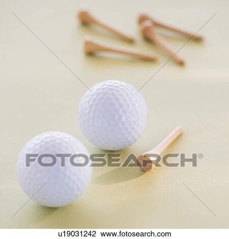 Stock Image - Studio shot of golf balls. Fotosearch