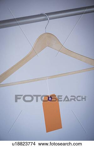 Picture - Studio shot of hanger with price tag. Fotosearch
