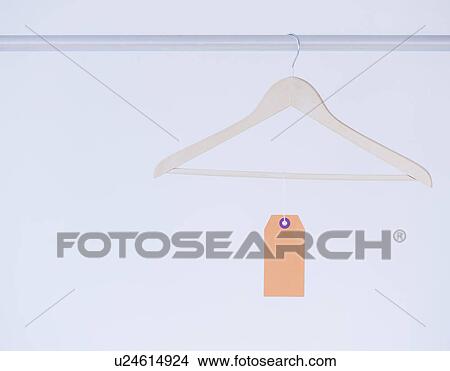 Studio shot of hanger with price tag View Large Photo Image Picture - Studio shot of hanger with price tag. Fotosearch