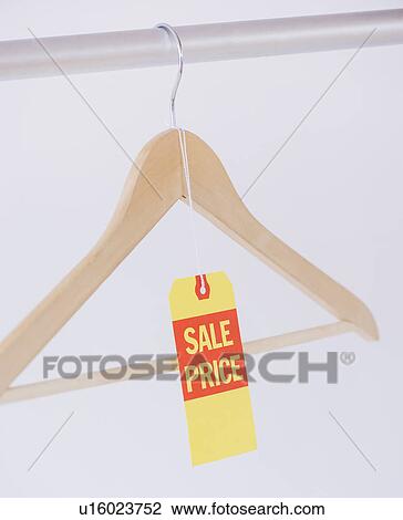 Studio shot of hanger with price tag View Large Photo Image Stock Image - Studio shot of hanger with price tag. Fotosearch