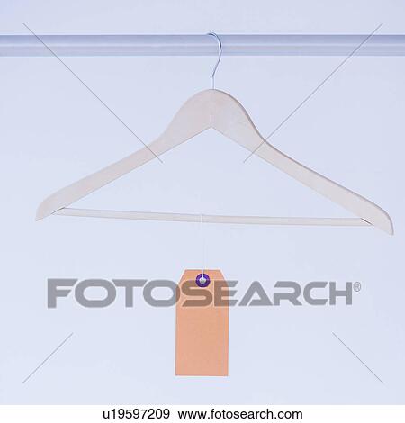 Studio shot of hanger with price tag View Large Photo Image Stock Photo - Studio shot of hanger with price tag. Fotosearch