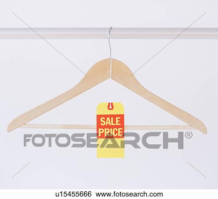 Stock Photograph - Studio shot of hanger with price tag. Fotosearch