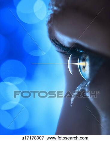 Stock Photo - Studio shot of light beam coming from eye. Fotosearch