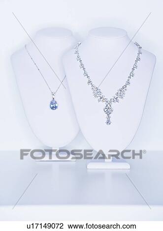 Stock Image - Studio shot of necklaces on jewelry stands. Fotosearch
