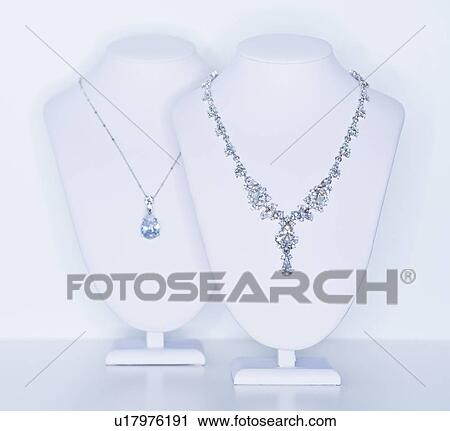 Stock Image - Studio shot of necklaces on jewelry stands. Fotosearch
