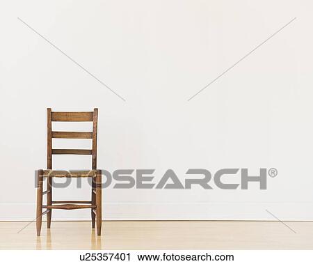 Stock Image - Studio shot of old chair. Fotosearch