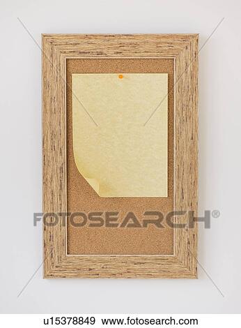 Stock Photo - Studio shot of paper on corkboard. Fotosearch