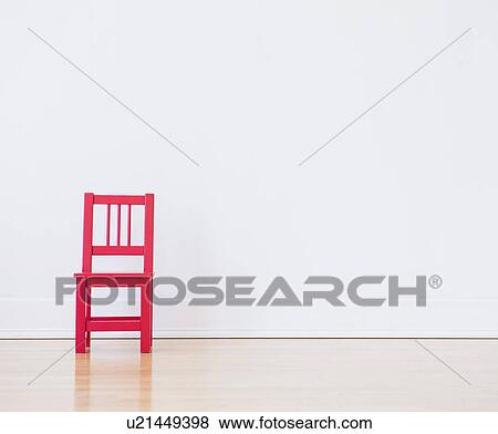 Stock Photo - Studio shot of red chair. Fotosearch