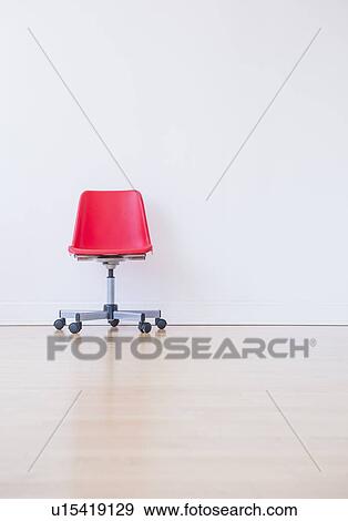 Stock Photo - Studio shot of red office chair. Fotosearch