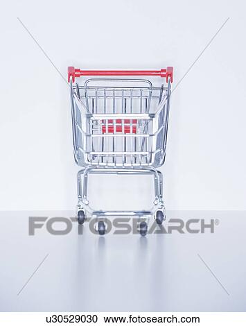 Studio shot of shopping cart View Large Photo Image Stock Image - Studio shot of shopping cart. Fotosearch
