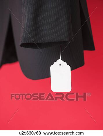 Stock Photo - Studio shot of suit with price tag. Fotosearch