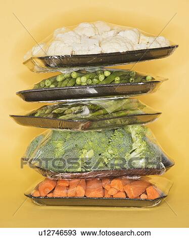 Studio shot of vegetables wrapped on trays View Large Photo Image Stock Image - Studio shot of vegetables wrapped on trays. Fotosearch