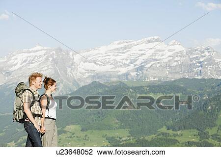 Switzerland, Leysin, Hikers marching through Alpine landscape View Large Photo Image Stock Image - Switzerland, Leysin, Hikers marching through Alpine landscape. Fotosearch