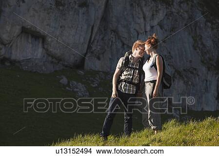 Switzerland, Leysin, Hikers on Alpine meadow View Large Photo Image Picture - Switzerland, Leysin, Hikers on Alpine meadow. Fotosearch