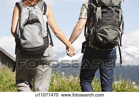 Switzerland, Leysin, Hikers walking and holding hands View Large Photo Image Stock Image - Switzerland, Leysin, Hikers walking and holding hands. Fotosearch