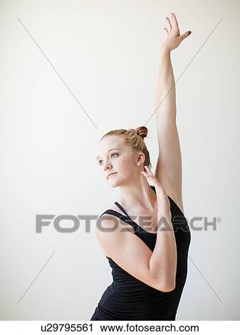 Teenage (16-17) gymnast exercising View Large Photo Image Stock Image - Teenage (16-17) gymnast exercising. Fotosearch