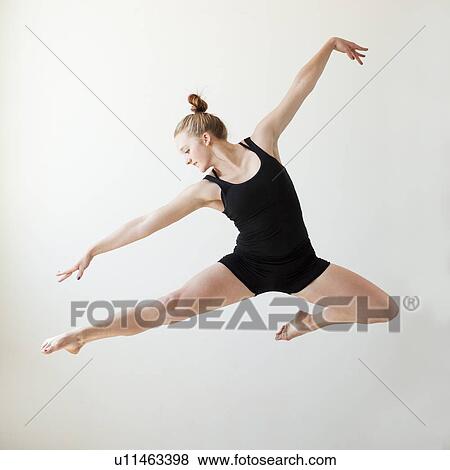 Teenage (16-17) gymnast exercising View Large Photo Image Stock Photo - Teenage (16-17) gymnast exercising. Fotosearch