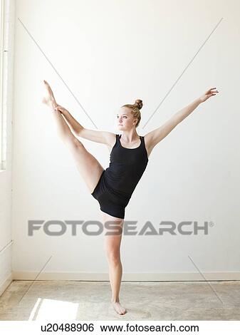 Teenage (16-17) gymnast exercising View Large Photo Image Stock Photograph - Teenage (16-17) gymnast exercising. Fotosearch