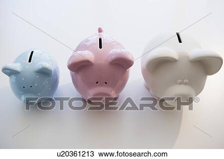 Stock Image - Three piggy banks in arranged order of magnitude. Fotosearch