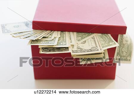 US dollar banknotes pouring out from box View Large Photo Image Picture - US dollar banknotes pouring out from box. Fotosearch