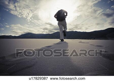 USA, Colorado, Great Sand Dunes National Park, Low angle view of tourist walking View Large Photo Image Stock Photo - USA, Colorado, Great Sand Dunes National Park, Low angle view of tourist walking. Fotosearch