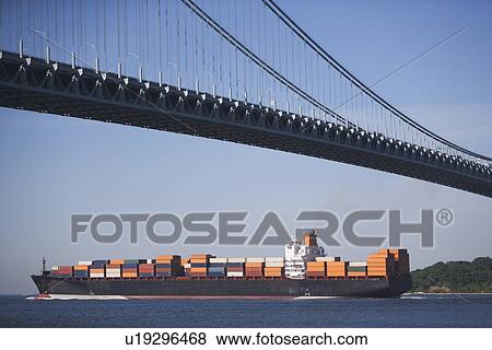 USA, New York City, Cargo ship passing by Verrazano Narrows Bridge View Large Photo Image Stock Photo - USA, New York City, Cargo ship passing by Verrazano Narrows Bridge. Fotosearch