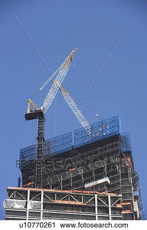 Stock Image - USA, New York City, Construction crane on site. Fotosearch