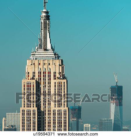 USA, New York City, Empire State Building with Manhattan skyline in background View Large Photo Image Stock Image - USA, New York City, Empire State Building with Manhattan skyline in background. Fotosearch