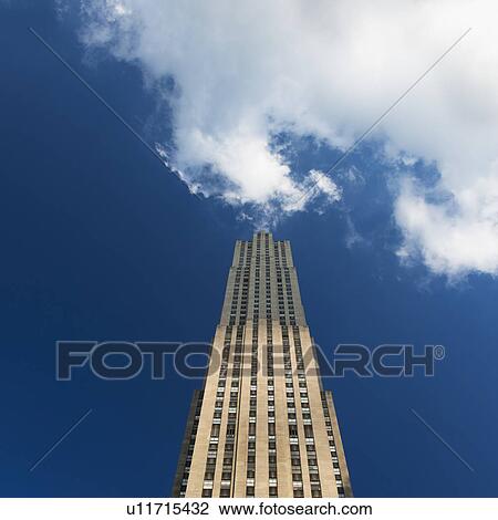 Stock Image - USA, New York City, Low angle view of Empire State Building . Fotosearch