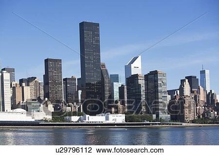 USA, New York City, Skyline against blue sky View Large Photo Image Stock Image - USA, New York City, Skyline against blue sky. Fotosearch